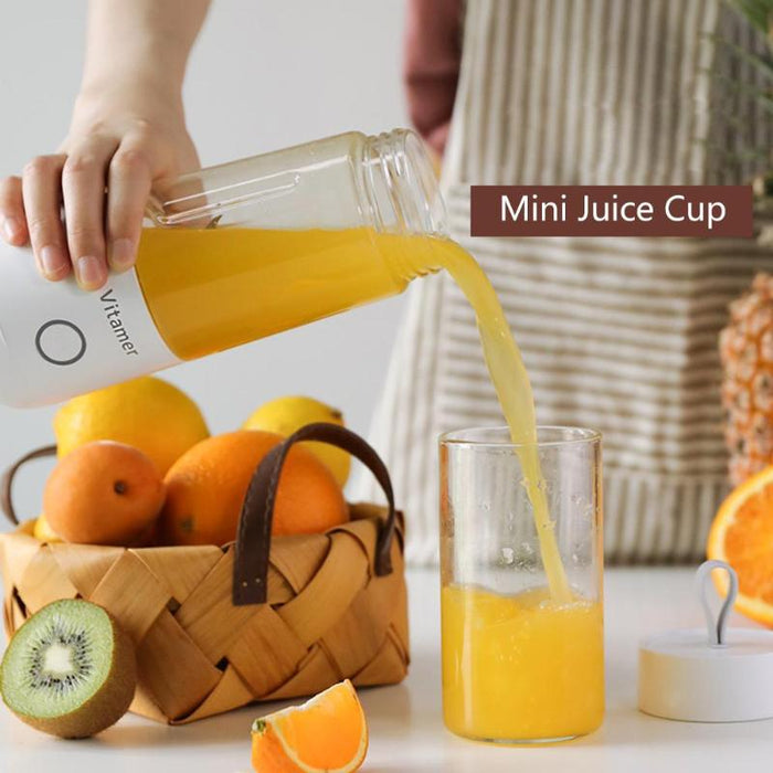 a glass of orange juice next to a glass of orange juice 