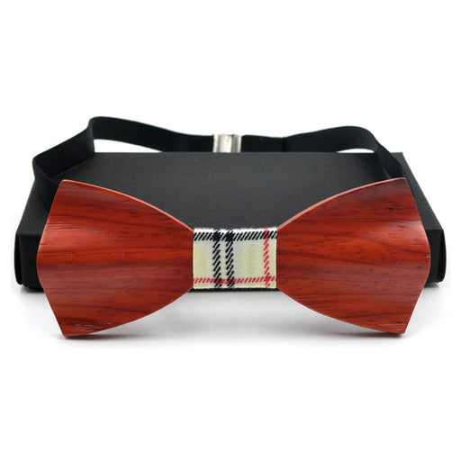 a black suit case with a red bow tie 